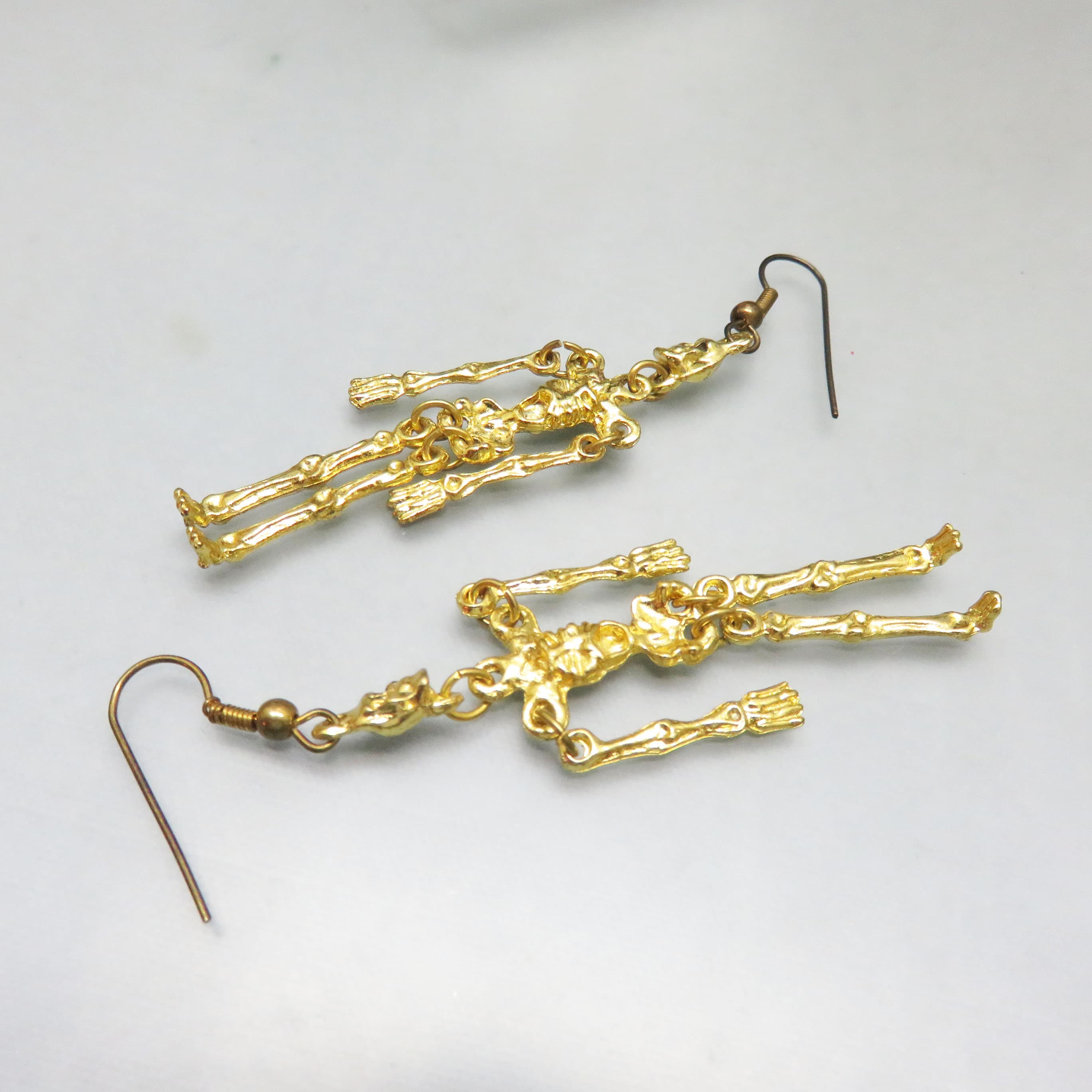 Gilded Bone Dance Articulated Skeleton Earrings