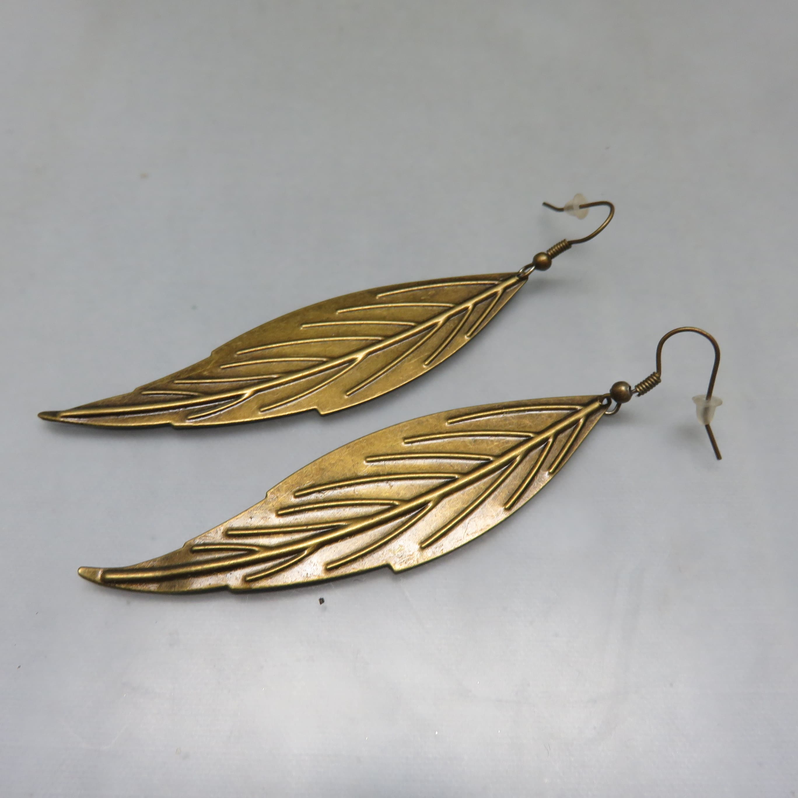 Oversized Stamped Feather Earrings – Golden Brass Finish