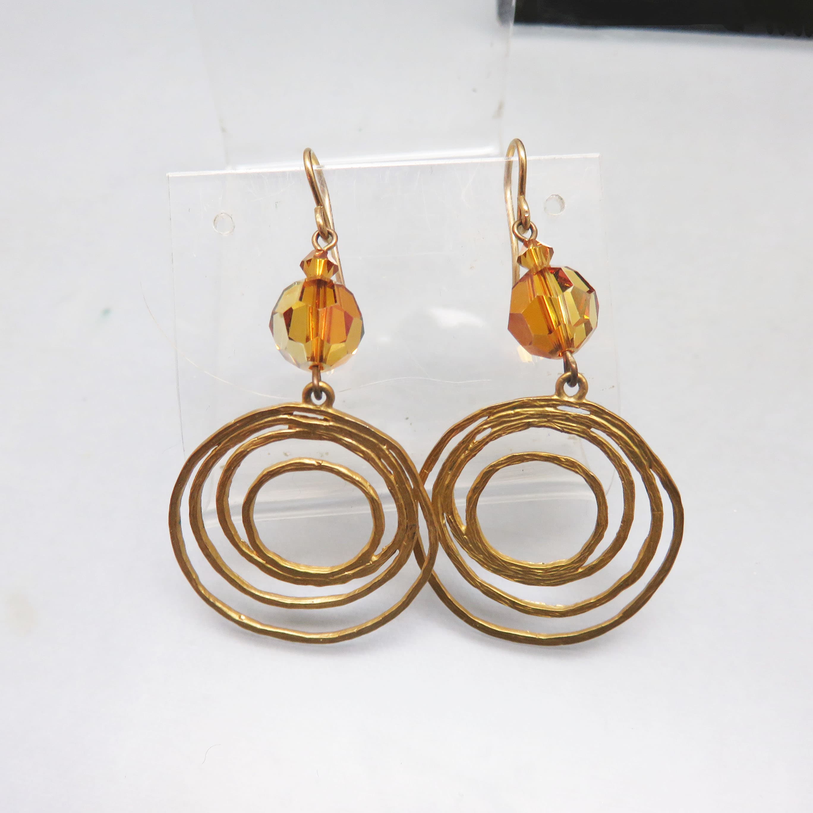 Matte Goldtone Concentric Circle Earrings with Golden AB Crystal
