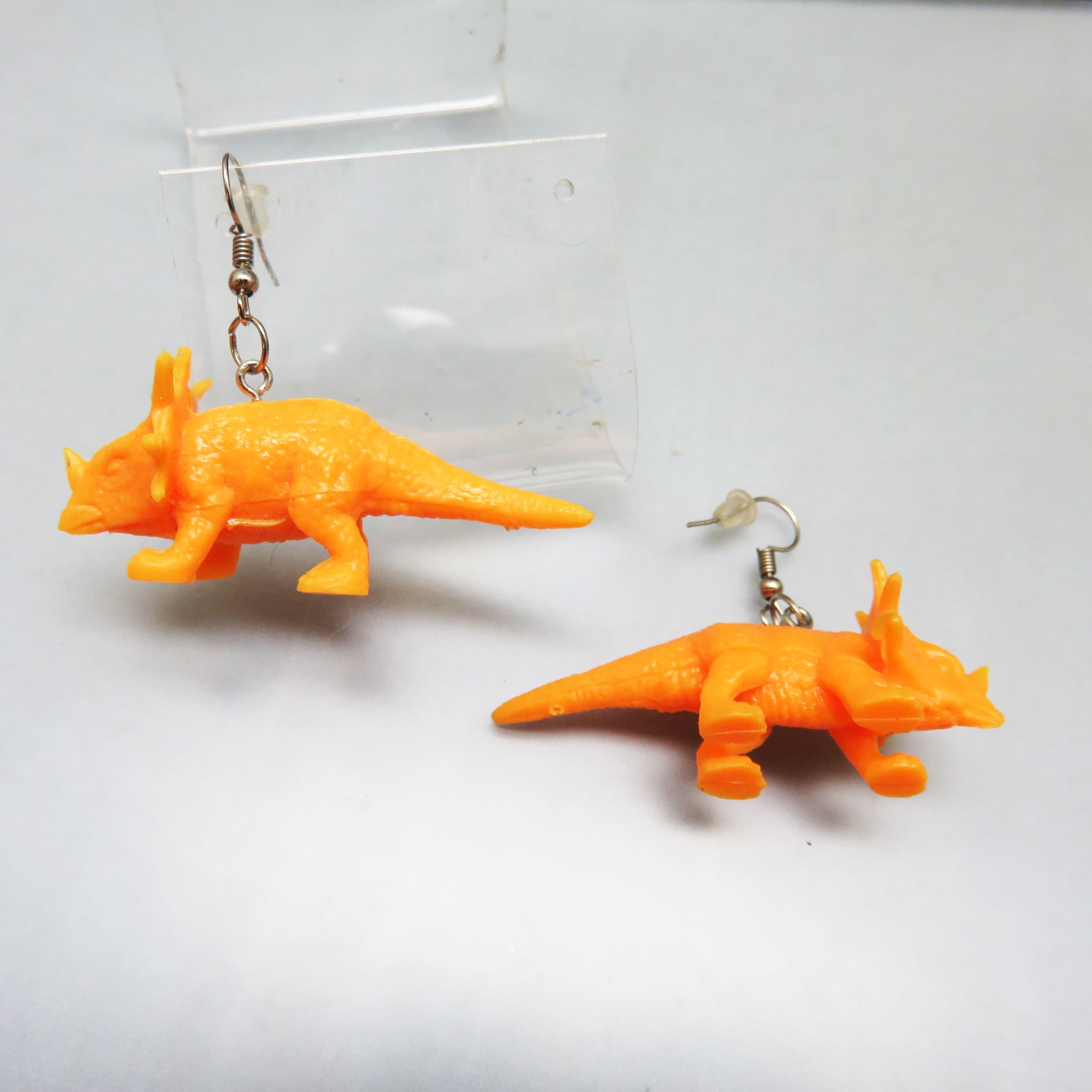 Orange Triceratops Earrings – Dimensional Plastic Dinosaur Dangles – Whimsical French Hook Earrings