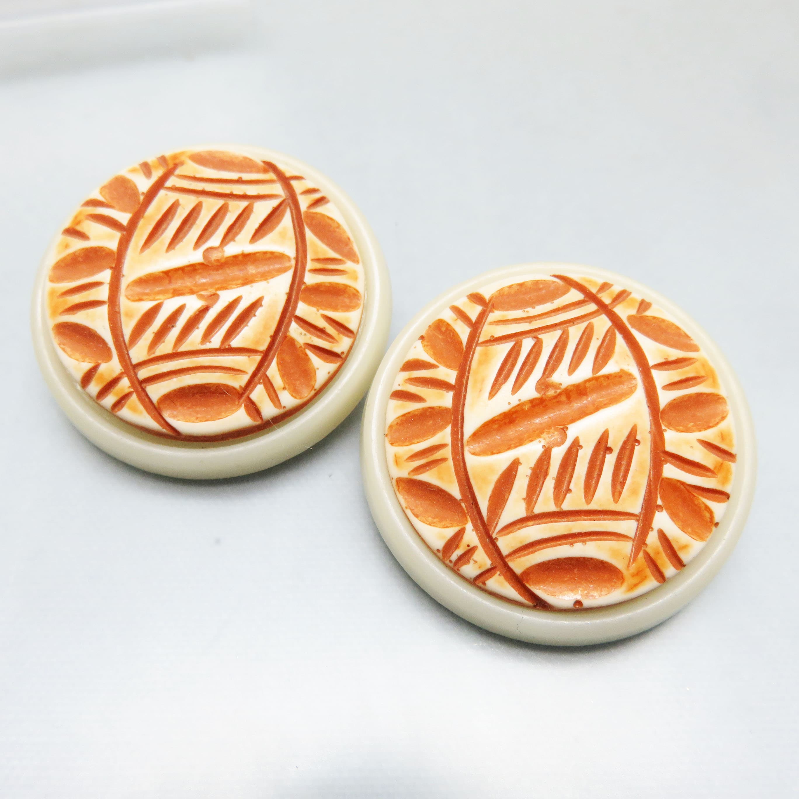 Vintage Carved-Look Plastic Clip-On Earrings – Ivory and Terracotta Statement Buttons